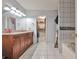 Bright bathroom showcases a double vanity, walk in closet, shower and separate tub at 151 River Park Cir, Mcdonough, GA 30252