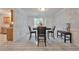 Dining room with elegant trim work, tile floors and a view into the kitchen area at 151 River Park Cir, Mcdonough, GA 30252
