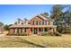 Charming two-story brick home with a welcoming front porch and well-maintained landscaping at 151 River Park Cir, Mcdonough, GA 30252