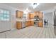 The kitchen is equipped with stainless appliances and has easy access to backyard at 151 River Park Cir, Mcdonough, GA 30252