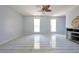 Spacious living room featuring ample natural light and modern tile floors at 151 River Park Cir, Mcdonough, GA 30252