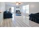 Cozy living room offers ample natural light, neutral decor, and tile floors at 151 River Park Cir, Mcdonough, GA 30252