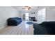 Open living room provides natural light, neutral paint, and vaulted ceilings at 151 River Park Cir, Mcdonough, GA 30252