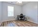 Office featuring hardwood floors, a desk, an office chair and a window at 151 River Park Cir, Mcdonough, GA 30252