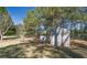 Fenced yard with storage shed, offering secure and convenient space for tools and garden supplies at 151 River Park Cir, Mcdonough, GA 30252