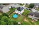 Aerial view showcases a delightful backyard with an inviting above-ground pool, enhancing the charm of this well-maintained property at 309 Daffodil Dr, Temple, GA 30179