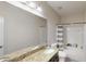 Bathroom featuring a granite countertop, a large mirror, and a shower-tub combo for a blend of style and practicality at 309 Daffodil Dr, Temple, GA 30179