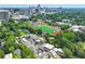 Aerial view of neighborhood with sports complex and city skyline at 67 Delmont Ne Dr, Atlanta, GA 30305