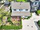Aerial view features a house with an outdoor living area, patio, and lush backyard at 67 Delmont Ne Dr, Atlanta, GA 30305