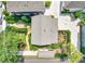 Aerial view of a home with a landscaped yard and a spacious driveway at 67 Delmont Ne Dr, Atlanta, GA 30305
