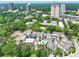 Aerial view showcasing a neighborhood with lush greenery at 67 Delmont Ne Dr, Atlanta, GA 30305