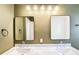 Updated bathroom features marble countertop, dual sinks, and modern mirrors and fixtures at 67 Delmont Ne Dr, Atlanta, GA 30305