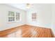 Bright bedroom features hardwood flooring, ceiling fan, and plenty of natural light at 67 Delmont Ne Dr, Atlanta, GA 30305