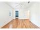 Bright bedroom featuring hardwood floors, a ceiling fan, and a closet at 67 Delmont Ne Dr, Atlanta, GA 30305
