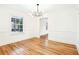 Dining area featuring modern light fixture, hardwood floors, and views to other rooms at 67 Delmont Ne Dr, Atlanta, GA 30305