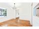 Bright dining room features a modern chandelier, white trim, and hardwood floors at 67 Delmont Ne Dr, Atlanta, GA 30305