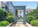 Welcoming community entrance gate with 'Delmont' and 'Hedgewood' signage surrounded by lush greenery at 67 Delmont Ne Dr, Atlanta, GA 30305