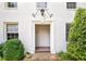 Welcoming entrance features brick steps, decorative lighting, and a stylish white trimmed doorway at 67 Delmont Ne Dr, Atlanta, GA 30305