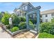 Charming view of Delmont entrance gate framed by lush landscaping and neighboring homes at 67 Delmont Ne Dr, Atlanta, GA 30305