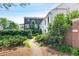 Serene walkway with lush landscaping, showcasing neighboring homes and the well-maintained property at 67 Delmont Ne Dr, Atlanta, GA 30305