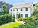 Traditional white brick home with well-maintained landscaping and inviting curb appeal at 67 Delmont Ne Dr, Atlanta, GA 30305