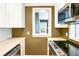 This kitchen view offers an open window to a back door and a stainless steel oven and microwave at 67 Delmont Ne Dr, Atlanta, GA 30305