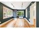 Living room with hardwood floors, neutral walls, large windows, and contemporary lighting at 67 Delmont Ne Dr, Atlanta, GA 30305
