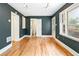Living room showing access to the bathroom, hardwood floors, and large windows at 67 Delmont Ne Dr, Atlanta, GA 30305