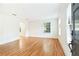 Bright living room with hardwood floors, large windows, and neutral walls for versatile styling at 67 Delmont Ne Dr, Atlanta, GA 30305