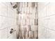 Shower design with vertically-aligned patterned tile, marble wall tile, and modern fixtures at 67 Delmont Ne Dr, Atlanta, GA 30305
