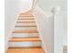 Staircase with wood treads and white risers and handrail at 67 Delmont Ne Dr, Atlanta, GA 30305