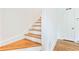 Traditional staircase with wood treads, white risers, and hardwood flooring at 67 Delmont Ne Dr, Atlanta, GA 30305