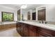 Bright bathroom with granite countertops, and cherry cabinets at 2005 Eagle Rdg, Roswell, GA 30076