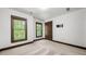Bright bedroom with two windows and neutral carpet, offering a serene and comfortable living space at 2005 Eagle Rdg, Roswell, GA 30076