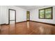 Bedroom with hardwood floors, window, and doorway at 2005 Eagle Rdg, Roswell, GA 30076