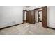 Bedroom featuring neutral carpet, white walls, and multiple entry doors at 2005 Eagle Rdg, Roswell, GA 30076