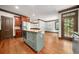 Kitchen with central island featuring natural countertops, stainless appliances, and an adjacent dining room at 2005 Eagle Rdg, Roswell, GA 30076
