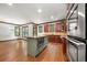 Kitchen boasts a large island, custom cabinets, stainless steel appliances, and hardwood flooring at 2005 Eagle Rdg, Roswell, GA 30076