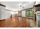 Bright living room boasts hardwood floors, fireplace, and large windows at 2005 Eagle Rdg, Roswell, GA 30076