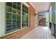 Charming brick porch with white pillars and outdoor seating area, perfect for enjoying the neighborhood views at 2005 Eagle Rdg, Roswell, GA 30076