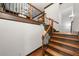 Elegant staircase features hardwood steps with decorative iron railings at 2005 Eagle Rdg, Roswell, GA 30076