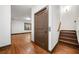 Small hardwood staircase next to an elevator, leading to the next floor at 2005 Eagle Rdg, Roswell, GA 30076