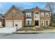 Beautiful two-story brick home with a two-car garage and well-maintained landscaping at 2730 Henderson Chase Ct, Tucker, GA 30084