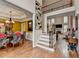 Open-concept living space with hardwood floors, a staircase, and views of the dining room at 2730 Henderson Chase Ct, Tucker, GA 30084