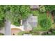 Aerial view of the home showing mature trees, fenced yard, and driveway at 3880 Admiral Dr, Chamblee, GA 30341