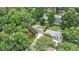 Aerial view of homes surrounded by mature trees and lush green lawns at 3880 Admiral Dr, Chamblee, GA 30341