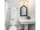 Bathroom featuring a pedestal sink, classic mirror, and neutral paint at 3880 Admiral Dr, Chamblee, GA 30341