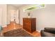 Bedroom featuring wooden floors, area rug, and view of open doorway at 3880 Admiral Dr, Chamblee, GA 30341