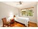Cozy bedroom with natural light, wood floors, and a neutral color palette at 3880 Admiral Dr, Chamblee, GA 30341