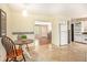 Bright breakfast nook with tiled floors and views of the living area at 3880 Admiral Dr, Chamblee, GA 30341